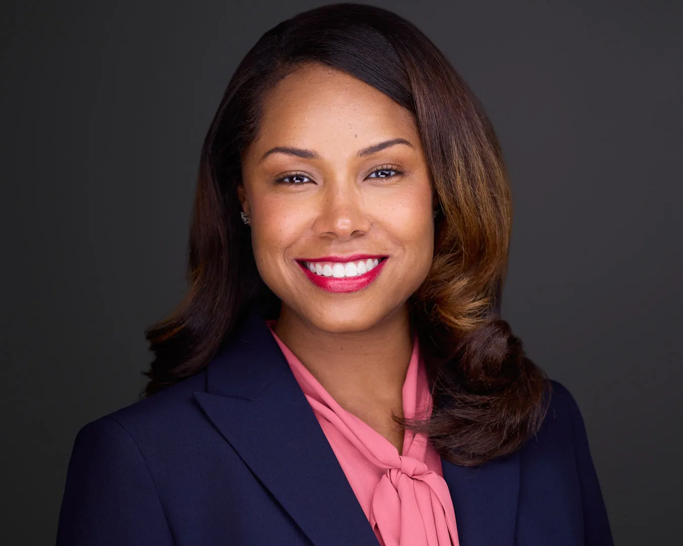 Professional headshot showing expert studio lighting and confident expression